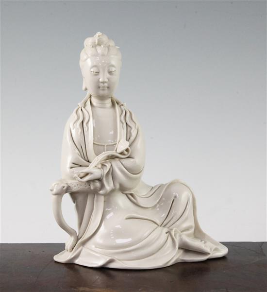 A Chinese blanc de chine seated figure of Guanyin, 20th century, 20.5cm